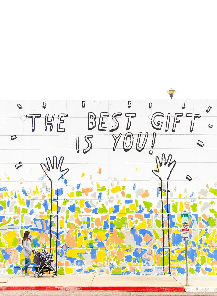 Callout to volunteer with Stitch the Gap with image displaying 'The best gift is you' graffiti
